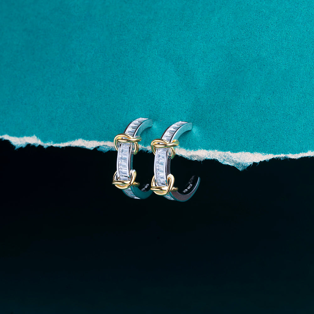 Reegalia Baguette Glow Huggie Earrings in 925 Silver.